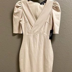 Pencil length dress with small slit down the back